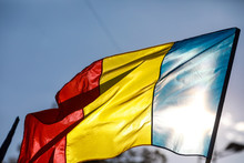 People Wave The Romanian Flag During A Rally