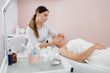 © Yakobchuk Olena - Beautiful young woman having face massage at spa salon