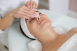 © Yakobchuk Olena - Beautician hands cleaning lady face before the procedure