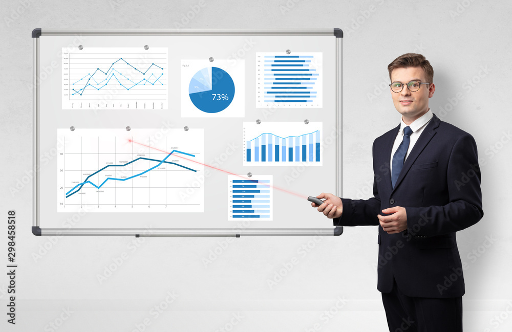 Handsome businessman presenting report on white board with laser pointer - obrazy, fototapety, plakaty 