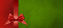 Gift Card Wishes Merry Christmas Background With Red Ribbon Bow On Green Shiny Vibrant Color Texture Template With Blank Copy Space