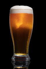 Wall Mural - Glass of beer isolated on black background.