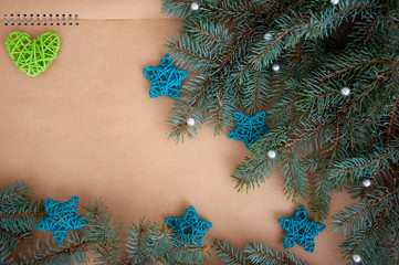  Christmas branches, cones, decorations on parchment paper. Holiday Christmas background.Copy space for text or design