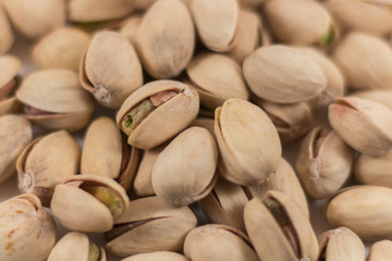 Close Up of a Pile of Organic Pistachios on White Background