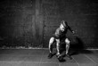 © Srdjan - Young strong fit muscular sweaty man with big muscles strength cross workout training with dumbbells weights in the gym dark image with shadows real people black and whit