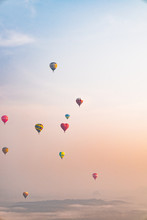Hot Air Balloons Against Sky At Sunrise