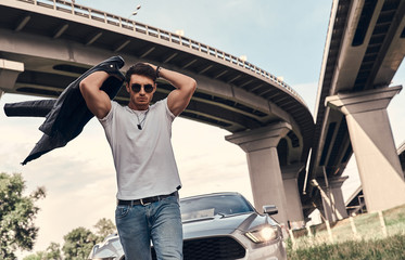 Wall Mural - Handsome man near car