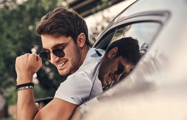 Handsome man in car