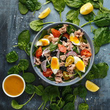 Protein Packed Tuna And Soft, Runny Egg Salad With Pear Shaped Cherry Tomatoes, Black Olives And Spinach