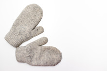 Gray Soft Knitted Mittens On White Background With Copy Space, Flat Lay