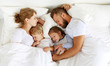healthy sleep. happy family parents and children sleeping in white bed