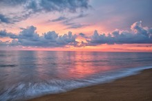 Phuket Beach Sunset, Colorful Cloudy Twilight Sky Reflecting On The Sand Gazing At The Indian Ocean, Thailand, Asia.