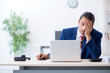 © Elnur - Young male businessman sitting in the office