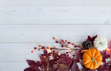 Orange And White Pumpkin On White Wood Background With Fall Leaves