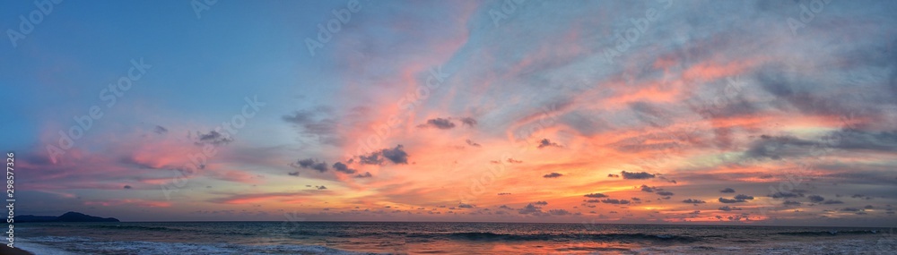 Phuket beach sunset, colorful cloudy twilight sky reflecting on the sand gazing at the Indian Ocean, Thailand, Asia. - obrazy, fototapety, plakaty 