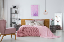 Pink Cozy Woolen Blanket And Duvet On Warm King Size Bed In Classy Bedroom Interior, Abstract Painting On Empty Wall