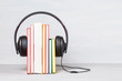 © netrun78 - Group of books with the earphones. Audiobooks concept