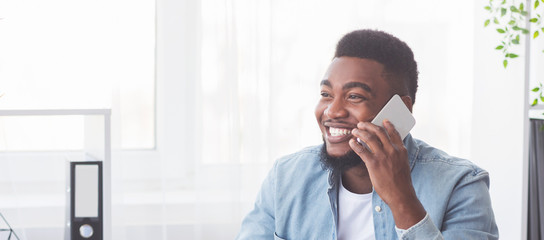 Poster - Successful black businessman talking on phone in office