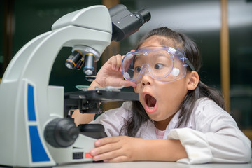 Wall Mural - little scientist is excited about science experiments