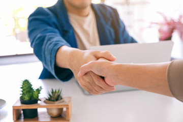 Poster - Closeup image of businesspeople shaking hands in office