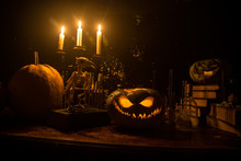 Halloween Still-life Background With Different Elements On Dark Toned Foggy Background. Selective Focus