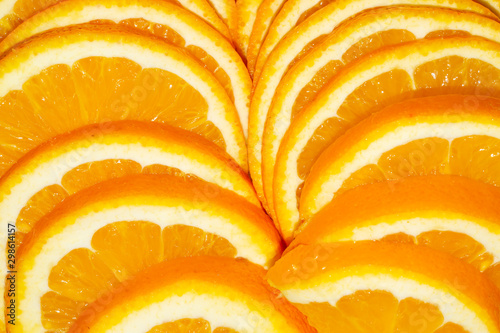 Fotomural Sliced orange. yellow fruit close up background