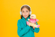 Present Of Love. Happy Child Hold Valentines Present Yellow Background. Toy Present For Kids. Holiday Celebration. Valentines Day. International Childrens Day. This Is Your Present