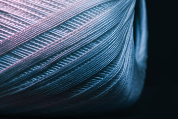 Poster - Close up beautiful tangle of thread in red and blue light background texture. Macro Photography view.