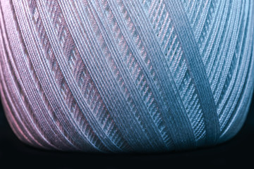Poster - Close up beautiful tangle of thread in red and blue light background texture. Macro Photography view.