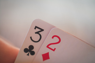 Playing cards in hand on the table, poker nands