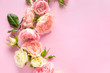 Beautiful blooming roses on color background