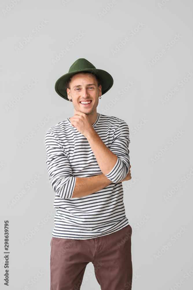 Portrait of handsome young man on light background