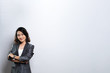 © chajamp - Happy woman thinking and standing isolated over white background