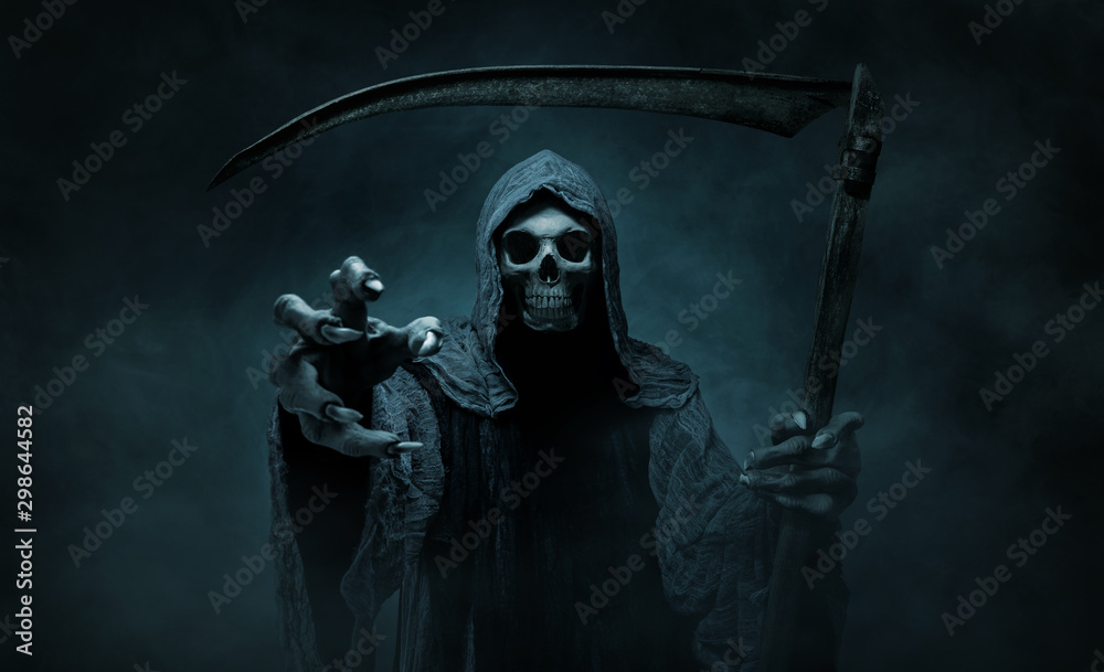 Grim reaper reaching towards the camera over dark, misty background with copy space - obrazy, fototapety, plakaty 