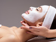 © Valua Vitaly - Spa massage for woman with facial mask on face