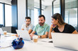 © AntonioDiaz - Leader Guiding Professionals Over Laptop At Office
