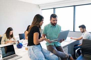 Wall Mural - Coworkers Working On Plan Together In Office