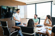 © AntonioDiaz - Professionals Discussing In Team At Workplace