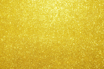 Wall Mural - gold Sparkling Lights Festive background with texture. Abstract Christmas twinkled bright bokeh defocused and Falling stars. Winter Card or invitation	