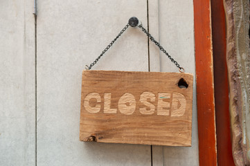 Wall Mural - sorry we are closed sign hanging outside a restaurant, store, office or other