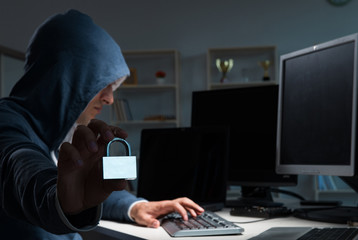 hacker hacking computer at night