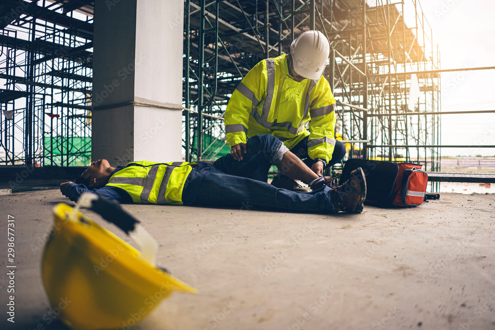 First aid support accident in site work, Builder accident fall scaffolding to the floor, Safety team help employee accident. - obrazy, fototapety, plakaty 