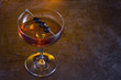 © kateholms - Manhattan cocktail on fireplace background
