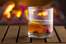 Old Fashion Cocktail On Fireplace Background