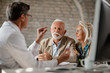 © Drazen - Getting an advice from healthcare expert!
