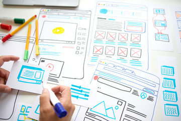 Designer planning draft sketch in design studio.