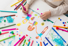 Child Draws His Friends With Markers. Creative Activities In Kindergarten. Children's Friendship