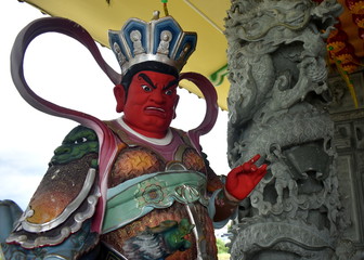 Sticker - Colorful warrior statue outside a Chinese temple