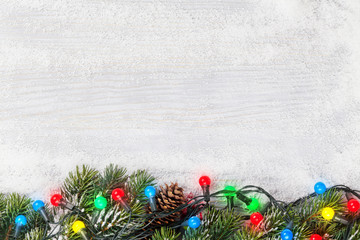 christmas card with fir tree and colorful lights