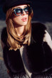 © Volodymyr - Beautiful woman in fur, urban style accessories and sunglasses. Lynx fur fashion beauty. Model looking at camera wearing stylish clothes and accessories. Luxury lifestyle and fashion concept.